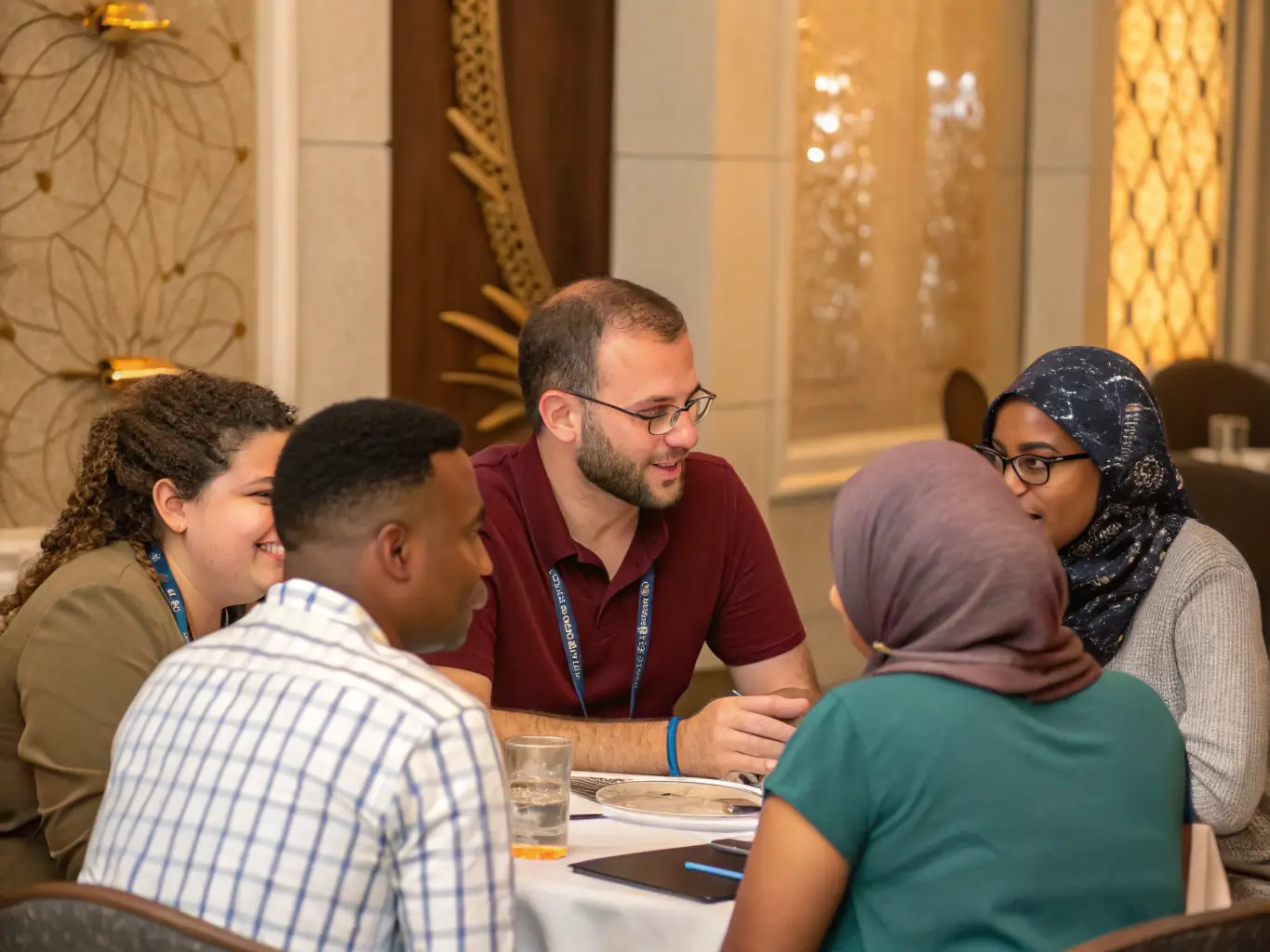 A warm, inviting image of a diverse group of people happily gathered around a table, symbolizing the accessibility and community focus of PaymentTech's personal loan services.